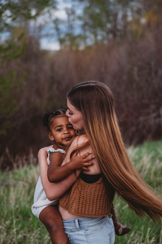 mom and daughter hug during mommy and me session
