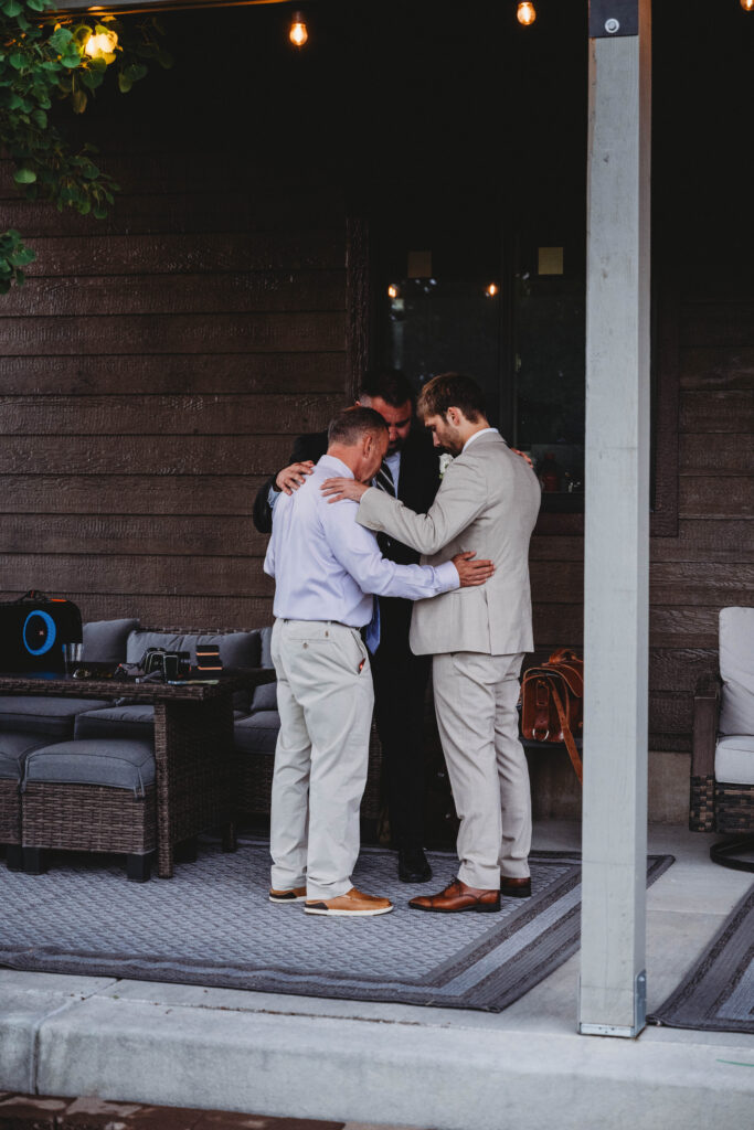 prayers with groom, father and officiant before the ceremony