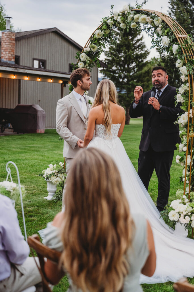 listening to the officiant share wisdom for the marriage covenant