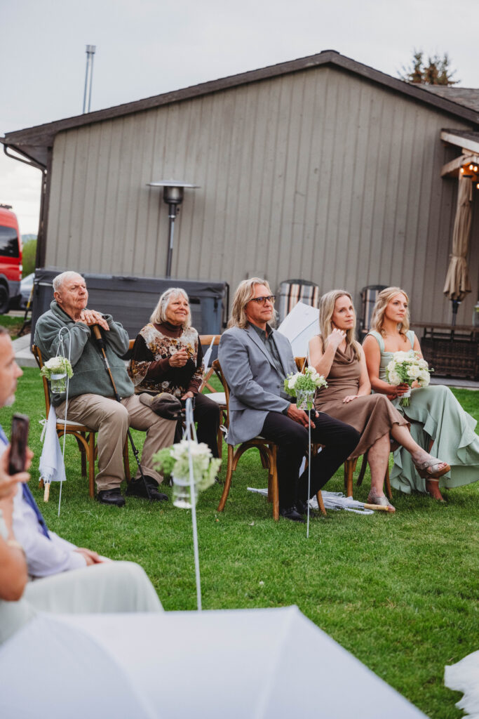 family watching a wedding ceremony