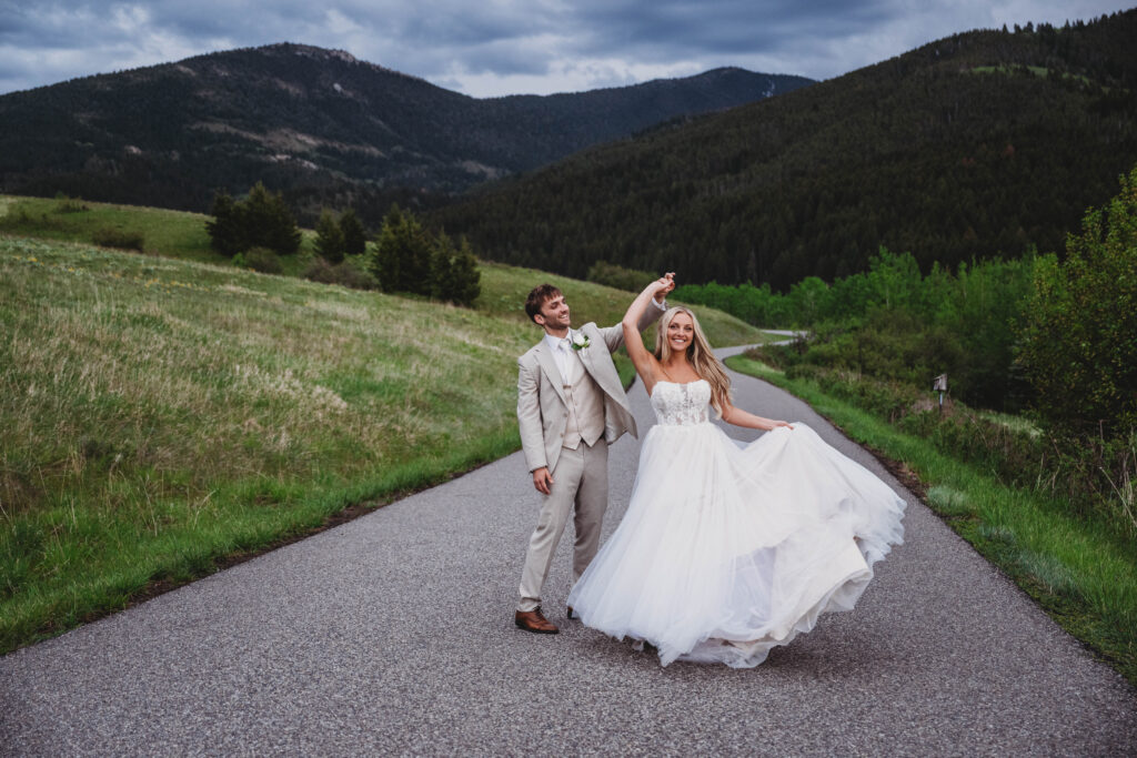 twirling on a windy road in montana celebrating how they just got married!