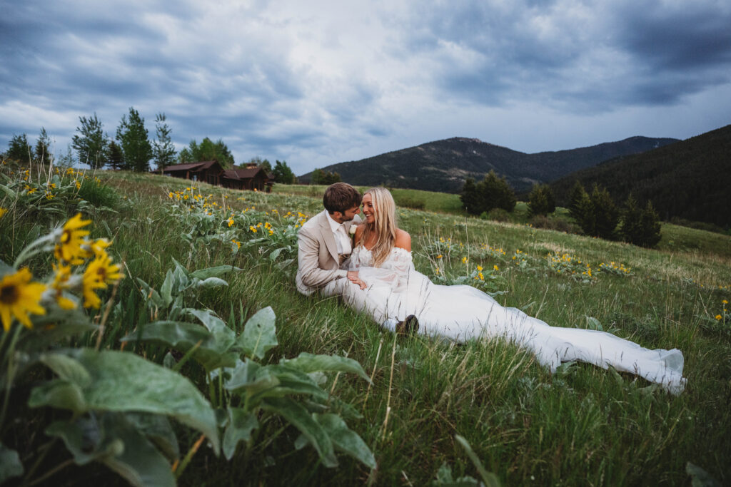 sitting amongst the wildflowers of Bozeman, Montana, this newlywed couple takes a second to enjoy each others company