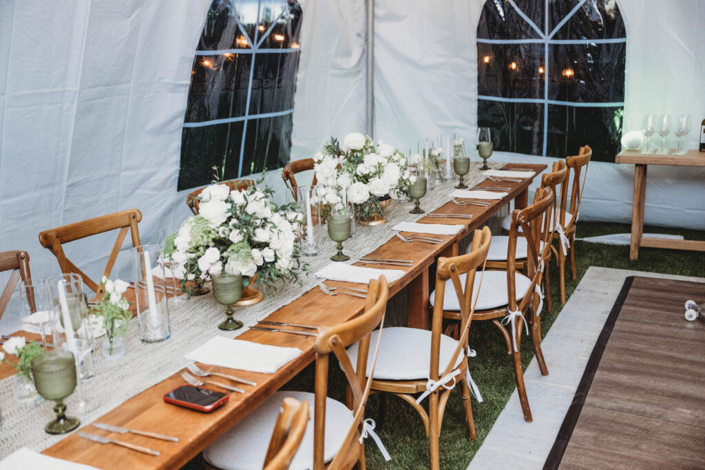 small intimate wedding reception dinner setup with decor and flowers